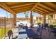 Outdoor patio with tables and chairs overlooking a pool and palm trees at 16233 E Rosetta Dr # 47, Fountain Hills, AZ 85268