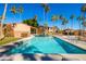 Community pool with palm trees and lounge chairs under a clear blue sky at 16233 E Rosetta Dr # 47, Fountain Hills, AZ 85268