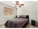 Cozy bedroom featuring a ceiling fan, window and comfortable bed at 1653 E Gail Dr, Chandler, AZ 85225
