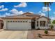 Charming single-story home featuring a two-car garage and a well-maintained desert landscape at 1653 E Gail Dr, Chandler, AZ 85225