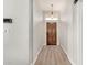 Entryway with wood floors, a pendant light, and views to the front door at 1653 E Gail Dr, Chandler, AZ 85225