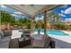 Inviting outdoor space with pool, covered patio, and comfortable seating at 1653 E Gail Dr, Chandler, AZ 85225