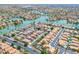 Aerial view of community featuring lakes, pools, and many homes at 16622 S 32Nd Pl, Phoenix, AZ 85048