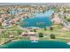 Breathtaking aerial shot of a lakeside community, showcasing the lake, palm trees, and surrounding homes at 16622 S 32Nd Pl, Phoenix, AZ 85048