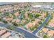 Aerial view of neighborhood with many homes, swimming pools, palm trees, and sidewalks at 16622 S 32Nd Pl, Phoenix, AZ 85048