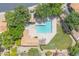 Aerial shot of a backyard pool and patio area with lush landscaping and outdoor seating at 16622 S 32Nd Pl, Phoenix, AZ 85048