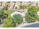 Aerial view of a private backyard featuring a pool, covered patio, lush landscaping, and outdoor amenities at 16622 S 32Nd Pl, Phoenix, AZ 85048