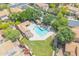 Overhead view of a private backyard pool, lush landscaping, covered patio, and outdoor seating area at 16622 S 32Nd Pl, Phoenix, AZ 85048