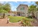 Home's backyard features a covered patio, lush landscaping, and a well-kept lawn at 16622 S 32Nd Pl, Phoenix, AZ 85048