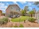Well-maintained backyard with covered patio, seating, and lush landscaping at 16622 S 32Nd Pl, Phoenix, AZ 85048