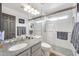 Bathroom with granite counters, a large mirror, and a glass enclosed shower at 16622 S 32Nd Pl, Phoenix, AZ 85048