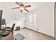 Cozy bedroom with a ceiling fan, and a light-filled window with stylish blinds at 16622 S 32Nd Pl, Phoenix, AZ 85048