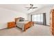 Comfortable bedroom with neutral carpet, a vaulted ceiling, and a decorative wood bed frame at 16622 S 32Nd Pl, Phoenix, AZ 85048