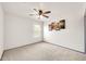Bright, unfurnished bedroom with neutral carpet, a ceiling fan, and a window at 16622 S 32Nd Pl, Phoenix, AZ 85048