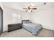 Comfortable bedroom featuring neutral carpet, a ceiling fan, and a window at 16622 S 32Nd Pl, Phoenix, AZ 85048