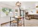 Cozy dining area with counter-height table, stools, and views to the outdoors, perfect for casual meals at 16622 S 32Nd Pl, Phoenix, AZ 85048