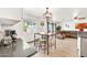 Bright dining area with counter-height table, stools, and views to the outdoors, perfect for casual meals at 16622 S 32Nd Pl, Phoenix, AZ 85048