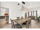 Open dining room with a modern dining set, great for Gathering meals, along with great view of the living room at 16622 S 32Nd Pl, Phoenix, AZ 85048