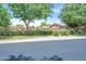 Charming home exterior featuring a well-manicured lawn, lush landscaping, and a secure iron fence at 16622 S 32Nd Pl, Phoenix, AZ 85048