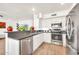 Functional kitchen with stainless steel appliances and dishwasher, seamlessly connects to the dining and living spaces at 16622 S 32Nd Pl, Phoenix, AZ 85048