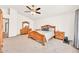 Spacious primary bedroom with neutral carpet, dresser, and fan at 16622 S 32Nd Pl, Phoenix, AZ 85048
