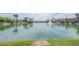 Beautiful lake view with a fountain, waterfront homes, and a tranquil atmosphere at 16622 S 32Nd Pl, Phoenix, AZ 85048