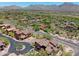 Aerial view showcasing the community with mountain views, tile roofs, and desert landscaping at 17665 N 93Rd Way, Scottsdale, AZ 85255