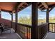 Covered balcony featuring outdoor seating and an attractive view of the surrounding landscaping at 17665 N 93Rd Way, Scottsdale, AZ 85255
