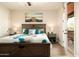 Bright bedroom with a view to the outside and a private balcony at 17665 N 93Rd Way, Scottsdale, AZ 85255