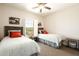 Bright, neutral bedroom featuring two twin beds, attractive decor, carpet, and a window view at 17665 N 93Rd Way, Scottsdale, AZ 85255