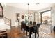 Inviting dining room with hardwood floors, chandelier, and access to outdoor patio at 17665 N 93Rd Way, Scottsdale, AZ 85255