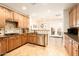 Well-equipped kitchen featuring wood cabinets, granite countertops, and stainless steel appliances at 17665 N 93Rd Way, Scottsdale, AZ 85255