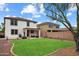 Well-maintained backyard with lush grass, a covered patio, and privacy fencing at 18222 W Lundberg St, Surprise, AZ 85388