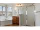 Bright bathroom with a soaking tub, a separate shower, and natural light from windows at 18222 W Lundberg St, Surprise, AZ 85388