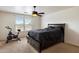 Cozy bedroom featuring a ceiling fan, natural light, and a bicycle machine at 18222 W Lundberg St, Surprise, AZ 85388