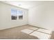 Inviting bedroom with neutral carpet, a window with blinds, and a serene atmosphere at 19390 N Fiano Dr, Maricopa, AZ 85138