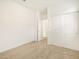 A well-lit bedroom features a sliding closet door, beige carpet, and fresh white walls at 19390 N Fiano Dr, Maricopa, AZ 85138