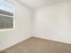 Bright bedroom with neutral carpet, a window with blinds, and a fresh, clean aesthetic at 19390 N Fiano Dr, Maricopa, AZ 85138