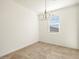 Bright and airy dining room featuring tile floors, neutral walls and modern chandelier at 19390 N Fiano Dr, Maricopa, AZ 85138