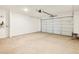 Spacious two-car garage features an automatic garage door and water heater at 19390 N Fiano Dr, Maricopa, AZ 85138