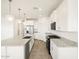 Stylish kitchen featuring stainless steel appliances, granite countertops, and a central island at 19390 N Fiano Dr, Maricopa, AZ 85138