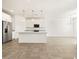 Modern kitchen with stainless steel appliances, white cabinets, granite countertops, and stylish pendant lighting at 19390 N Fiano Dr, Maricopa, AZ 85138