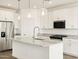 Beautiful kitchen with granite countertops, stainless steel appliances, and a stylish faucet on the island at 19390 N Fiano Dr, Maricopa, AZ 85138