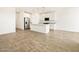 Bright, open kitchen boasts white cabinets, stainless steel appliances, and a granite countertop island at 19390 N Fiano Dr, Maricopa, AZ 85138