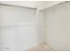Bright walk-in closet with wire shelving and ample space for organizing clothes and accessories at 19390 N Fiano Dr, Maricopa, AZ 85138