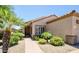 Inviting single-story home featuring desert landscaping, a tiled roof, and a welcoming front entrance at 19607 N Flint Way, Surprise, AZ 85374
