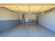 Clean and organized garage space with ample storage, painted walls, and a well-maintained floor at 19607 N Flint Way, Surprise, AZ 85374