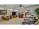 Cozy living room featuring a ceiling fan, slider to backyard, and comfortable seating area at 19607 N Flint Way, Surprise, AZ 85374