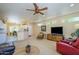 Bright living room featuring recessed lighting, an entertainment center, and a peek into the dining area at 19607 N Flint Way, Surprise, AZ 85374
