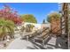 Backyard lounge area with mature plantings, gravel landscaping and two lounge chairs at 19930 N 98Th Ave, Peoria, AZ 85382